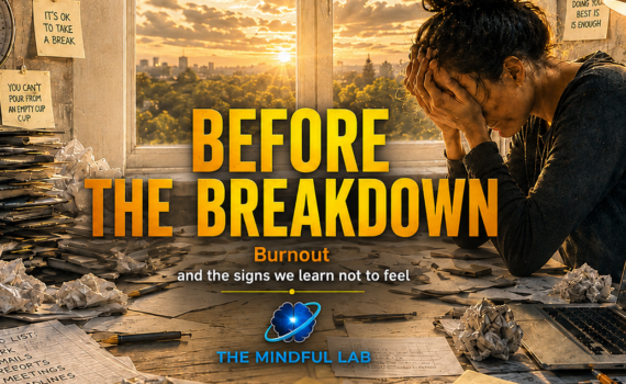 Before The Breakdown: Burnout - Tired person sitting by a window in a bright home office, pausing away from work while a cluttered desk suggests stress, overload, and burnout.